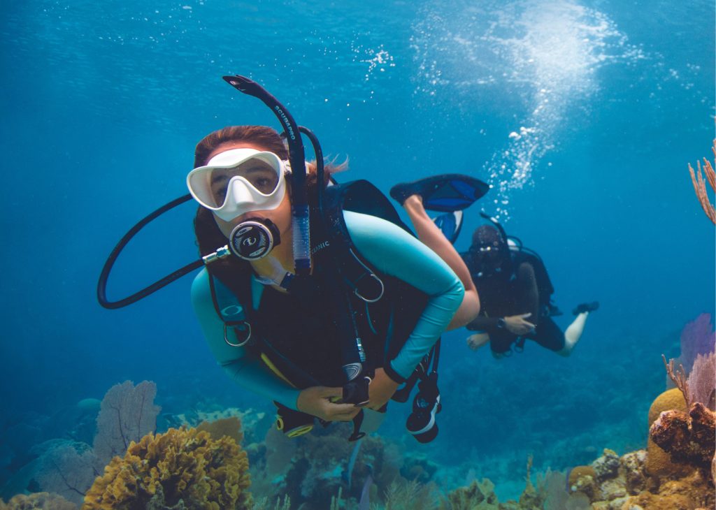 Diver entering swim-through at Racha