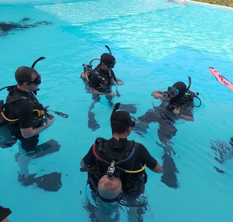 Student practicing scuba skills in pool at Seawave Diving Phuket