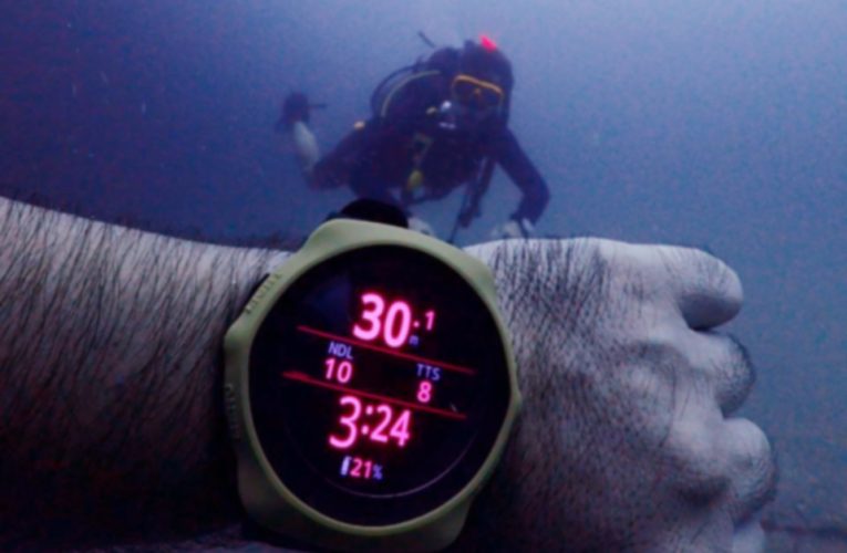 PADI Deep Diver student descending along a sloping reef wall at 31 meters