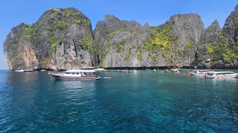 Aerial view of Maya Bay with turquoise waters and limestone cliffs near Phi Phi Islands in Thailand